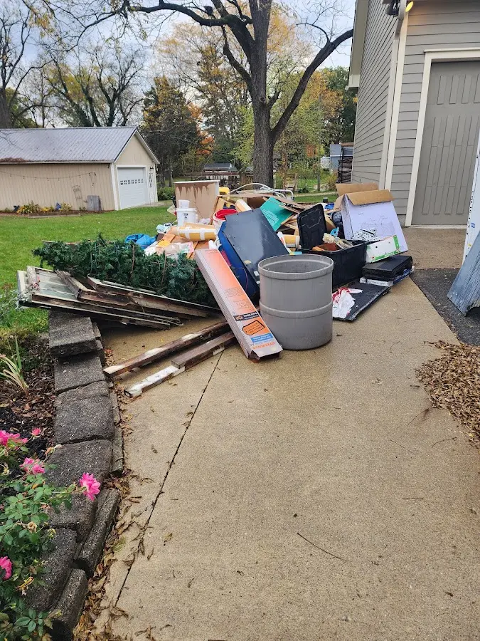 Dumpster being loaded with debris for 30 Yard Dumpster Rental in Effingham